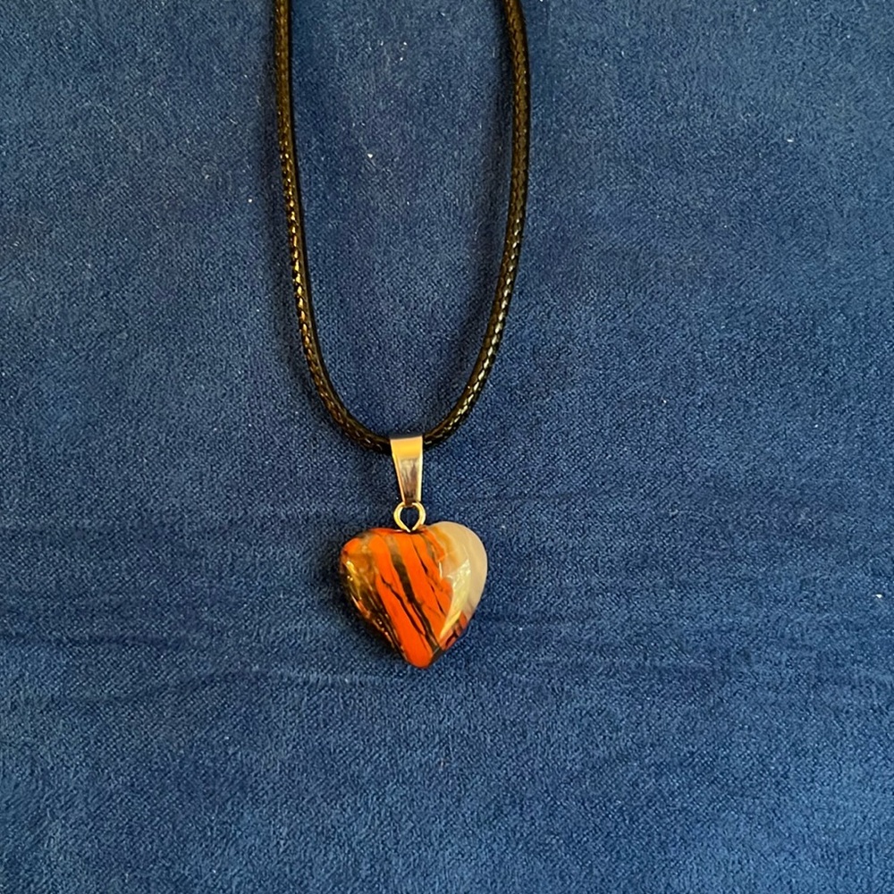 Black, burgundy, cream, brown hart pendant‎ necklace.
